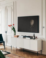 The Flower by Nathan Larson. shown as a framed stretched canvas in a living room above a console. Available as a archival giclee rolled canvas, fine art paper, or poster print. SKU 82421i.