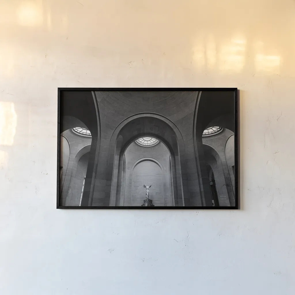 The Winged Victory of Samothrace by Nathan Larson. shown as a paper print in a black flame. Available as a archival giclee rolled canvas, fine art paper, or poster print. SKU 81749i.