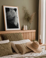 Thoughtful Bear BW by Nathan Larson. shown as a paper print in a natural frame. Available as a archival giclee rolled canvas, fine art paper, or poster print. SKU 100758h.