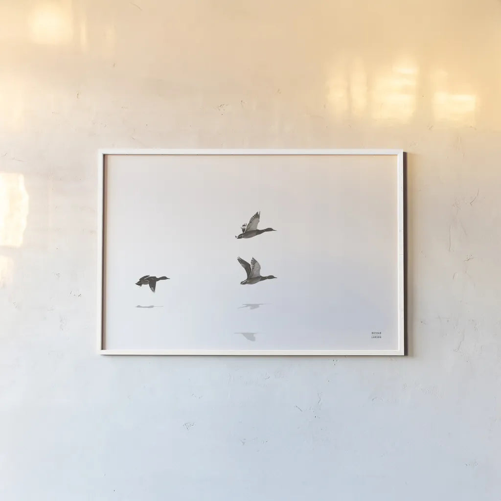Three Departing by Nathan Larson. shown as a paper print in a white frame. Available as a archival giclee rolled canvas, fine art paper, or poster print. SKU 77894i.