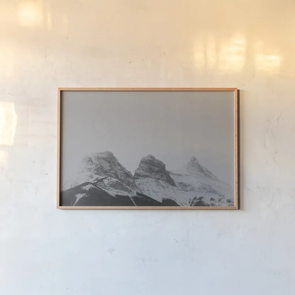 Three Sisters View by Nathan Larson. shown as a paper print in a natural frame. Available as a archival giclee rolled canvas, fine art paper, or poster print. SKU 86712i.