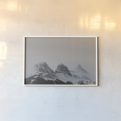 Three Sisters View by Nathan Larson. shown as a paper print in a white frame. Available as a archival giclee rolled canvas, fine art paper, or poster print. SKU 86712i.