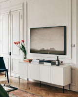 Timeless Monument Valley by Nathan Larson. shown as a framed stretched canvas in a living room above a console. Available as a archival giclee rolled canvas, fine art paper, or poster print. SKU 87106i.