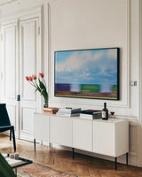 Train Dreams by Nathan Larson. shown as a framed stretched canvas in a living room above a console. Available as a archival giclee rolled canvas, fine art paper, or poster print. SKU 103383i.