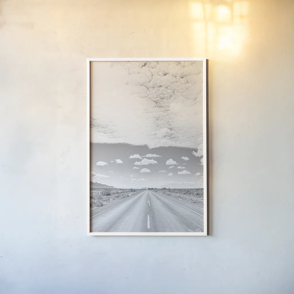Tres Hermanas Clouds by Nathan Larson. shown as a paper print in a white frame. Available as a archival giclee rolled canvas, fine art paper, or poster print. SKU 73735h.