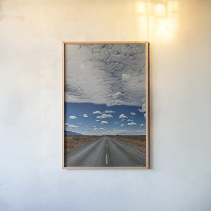 Tres Hermanas Clouds Color by Nathan Larson. shown as a paper print in a natural frame. Available as a archival giclee rolled canvas, fine art paper, or poster print. SKU 77277h.