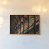 Trinity Library Design by Nathan Larson. shown as a paper print in a natural frame. Available as a archival giclee rolled canvas, fine art paper, or poster print. SKU 103687i.