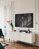 Trinity Library Design BW by Nathan Larson. shown as a framed stretched canvas in a living room above a console. Available as a archival giclee rolled canvas, fine art paper, or poster print. SKU 103688i.