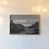 Twillingate Coast BW by Nathan Larson. shown as a paper print in a natural frame. Available as a archival giclee rolled canvas, fine art paper, or poster print. SKU 103184i.