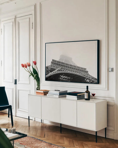 Under Eiffel Misty Day by Nathan Larson. shown as a framed stretched canvas in a living room above a console. Available as a archival giclee rolled canvas, fine art paper, or poster print. SKU 82299i.