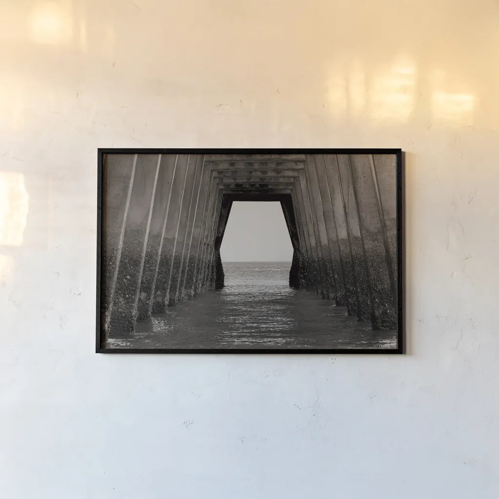 Under the Pier by Nathan Larson. shown as a paper print in a black flame. Available as a archival giclee rolled canvas, fine art paper, or poster print. SKU 97580i.