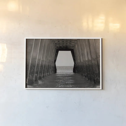 Under the Pier by Nathan Larson. shown as a paper print in a white frame. Available as a archival giclee rolled canvas, fine art paper, or poster print. SKU 97580i.