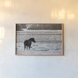 Waiting by Nathan Larson. shown as a paper print in a natural frame. Available as a archival giclee rolled canvas, fine art paper, or poster print. SKU 99370i.