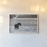 Waiting by Nathan Larson. shown as a paper print in a white frame. Available as a archival giclee rolled canvas, fine art paper, or poster print. SKU 99370i.