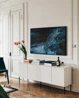 Water Light IV by Nathan Larson. shown as a framed stretched canvas in a living room above a console. Available as a archival giclee rolled canvas, fine art paper, or poster print. SKU 103798i.