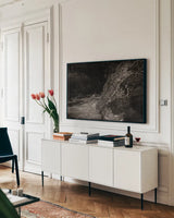 Water Light IV Sepia by Nathan Larson. shown as a framed stretched canvas in a living room above a console. Available as a archival giclee rolled canvas, fine art paper, or poster print. SKU 103799i.