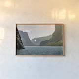Western Brook Pond by Nathan Larson. shown as a paper print in a natural frame. Available as a archival giclee rolled canvas, fine art paper, or poster print. SKU 101660i.