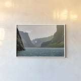 Western Brook Pond by Nathan Larson. shown as a paper print in a white frame. Available as a archival giclee rolled canvas, fine art paper, or poster print. SKU 101660i.