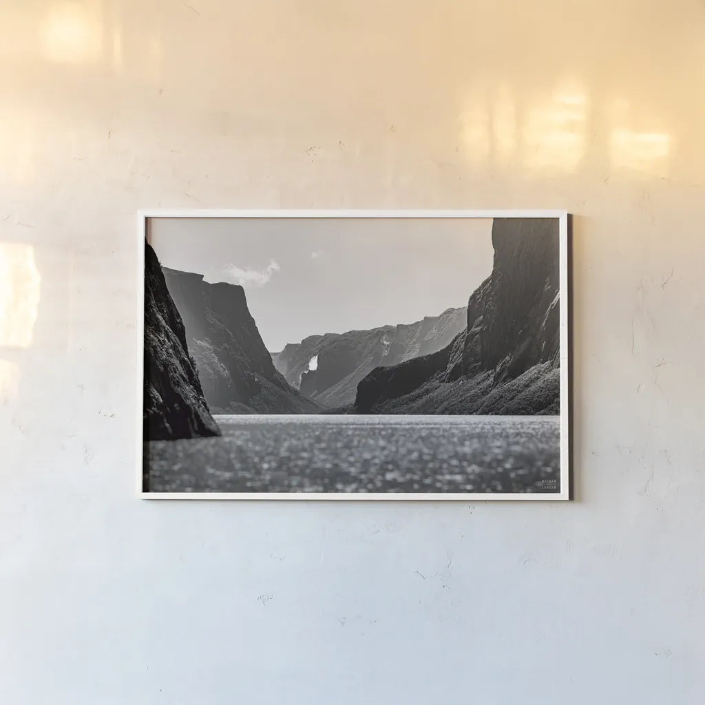 Western Brook Pond BW by Nathan Larson. shown as a paper print in a white frame. Available as a archival giclee rolled canvas, fine art paper, or poster print. SKU 101662i.