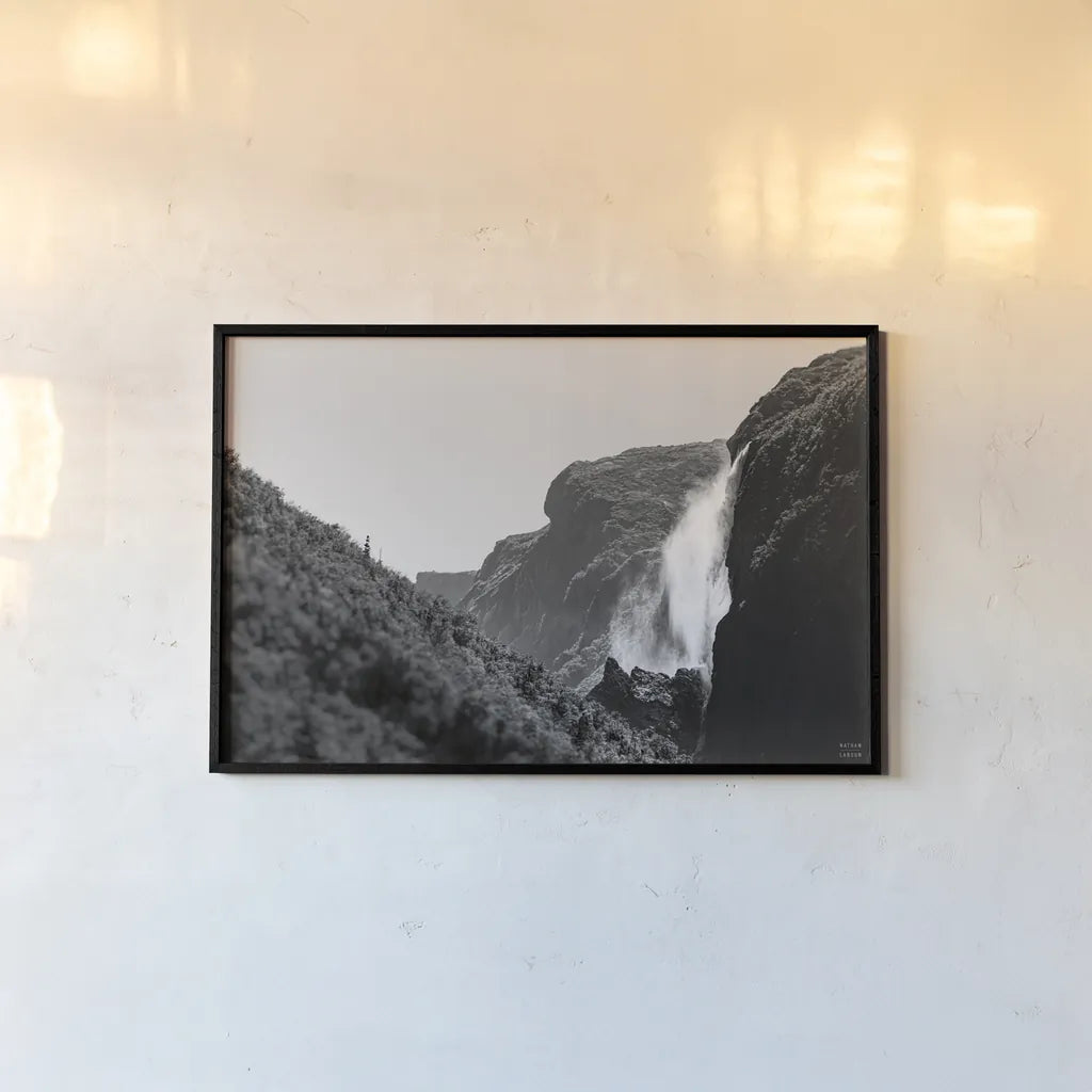 Western Brook Pond Falls BW by Nathan Larson. shown as a paper print in a black flame. Available as a archival giclee rolled canvas, fine art paper, or poster print. SKU 101659i.