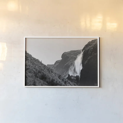 Western Brook Pond Falls BW by Nathan Larson. shown as a paper print in a white frame. Available as a archival giclee rolled canvas, fine art paper, or poster print. SKU 101659i.