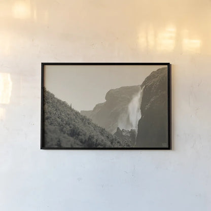 Western Brook Pond Falls Sepia by Nathan Larson. shown as a paper print in a black flame. Available as a archival giclee rolled canvas, fine art paper, or poster print. SKU 101658i.