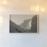 Western Brook Pond Falls Sepia by Nathan Larson. shown as a paper print in a white frame. Available as a archival giclee rolled canvas, fine art paper, or poster print. SKU 101658i.