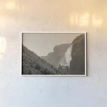 Western Brook Pond Falls Sepia by Nathan Larson. shown as a paper print in a white frame. Available as a archival giclee rolled canvas, fine art paper, or poster print. SKU 101658i.