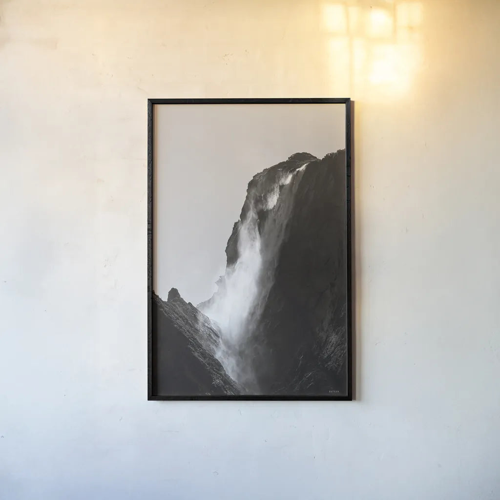 Western Brook Pond Waterfall by Nathan Larson. shown as a paper print in a black flame. Available as a archival giclee rolled canvas, fine art paper, or poster print. SKU 100501h.