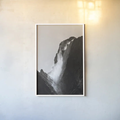 Western Brook Pond Waterfall by Nathan Larson. shown as a paper print in a white frame. Available as a archival giclee rolled canvas, fine art paper, or poster print. SKU 100501h.