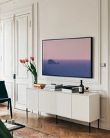 Whale Rock by Nathan Larson. shown as a framed stretched canvas in a living room above a console. Available as a archival giclee rolled canvas, fine art paper, or poster print. SKU 90181i.