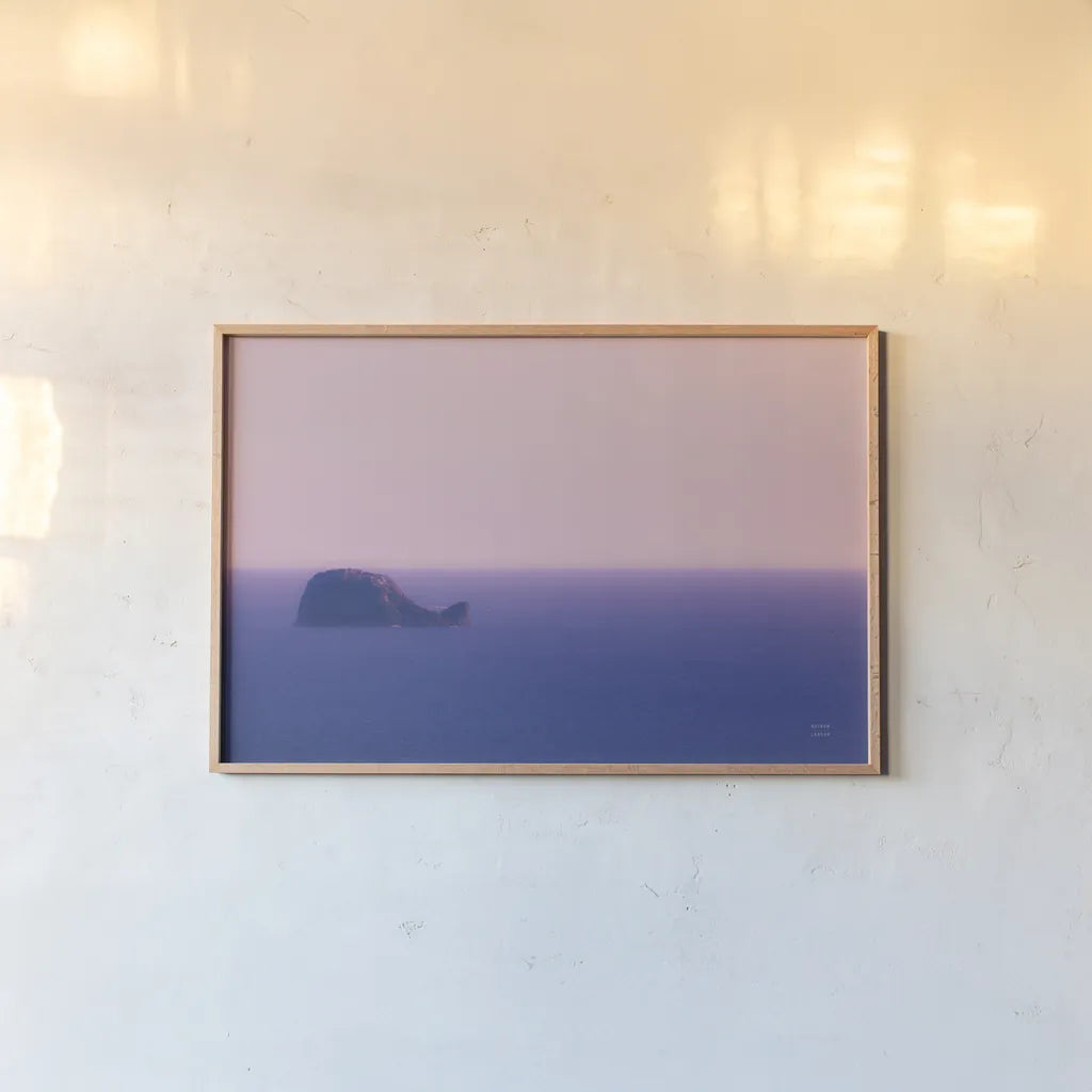 Whale Rock by Nathan Larson. shown as a paper print in a natural frame. Available as a archival giclee rolled canvas, fine art paper, or poster print. SKU 90181i.