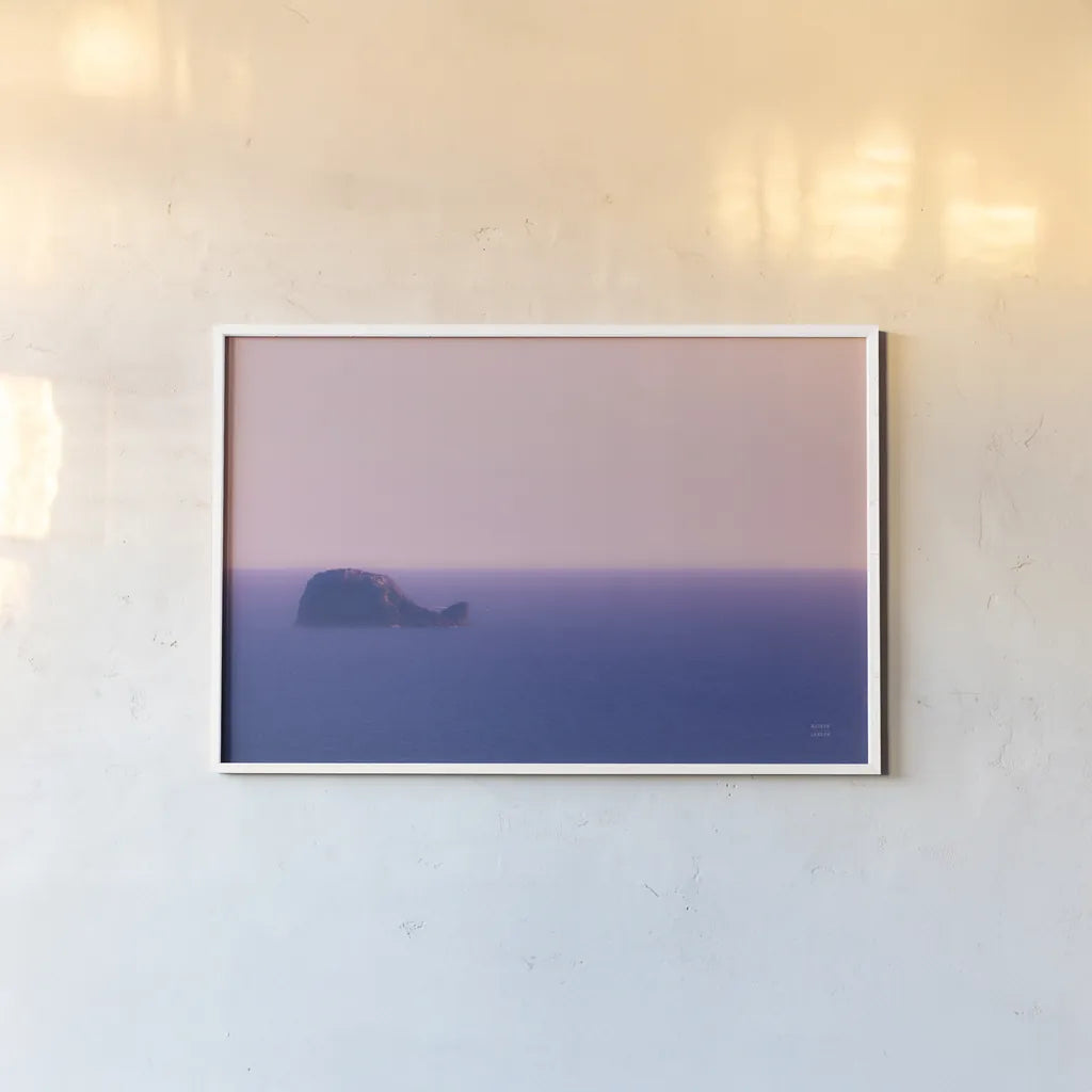 Whale Rock by Nathan Larson. shown as a paper print in a white frame. Available as a archival giclee rolled canvas, fine art paper, or poster print. SKU 90181i.
