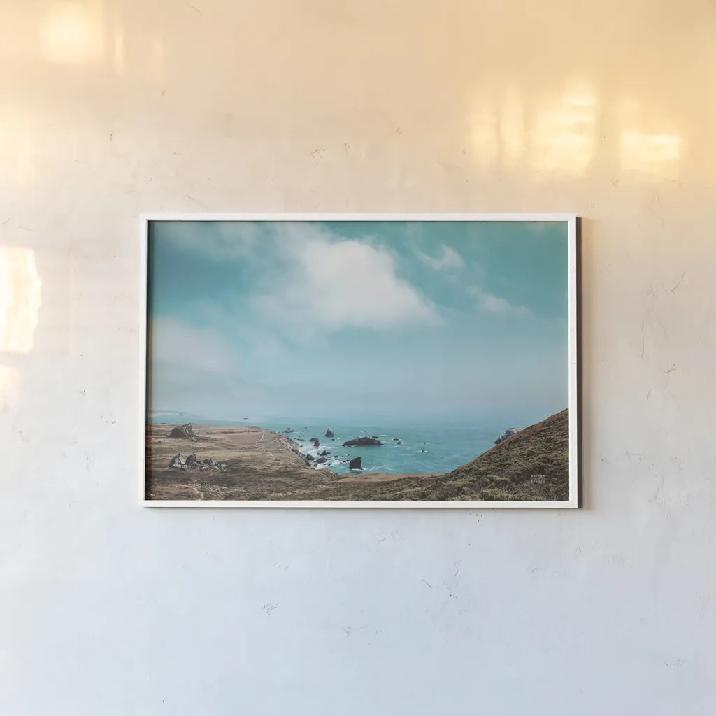 When Sea Becomes Sky by Nathan Larson. shown as a paper print in a white frame. Available as a archival giclee rolled canvas, fine art paper, or poster print. SKU 88868i.