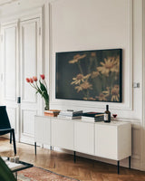 Wild Blooms I by Nathan Larson. shown as a framed stretched canvas in a living room above a console. Available as a archival giclee rolled canvas, fine art paper, or poster print. SKU 85770i.
