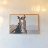 Wind Blown by Nathan Larson. shown as a paper print in a natural frame. Available as a archival giclee rolled canvas, fine art paper, or poster print. SKU 83663i.