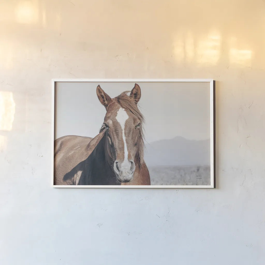 Wind Blown by Nathan Larson. shown as a paper print in a white frame. Available as a archival giclee rolled canvas, fine art paper, or poster print. SKU 83663i.
