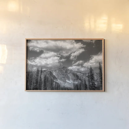 Wyoming Blues by Nathan Larson. shown as a paper print in a natural frame. Available as a archival giclee rolled canvas, fine art paper, or poster print. SKU 81751i.