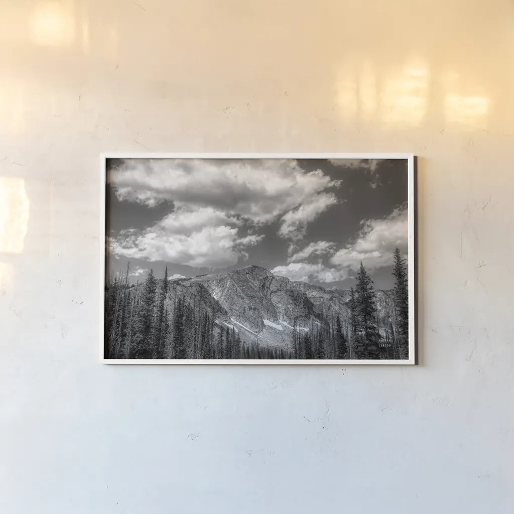 Wyoming Blues by Nathan Larson. shown as a paper print in a white frame. Available as a archival giclee rolled canvas, fine art paper, or poster print. SKU 81751i.