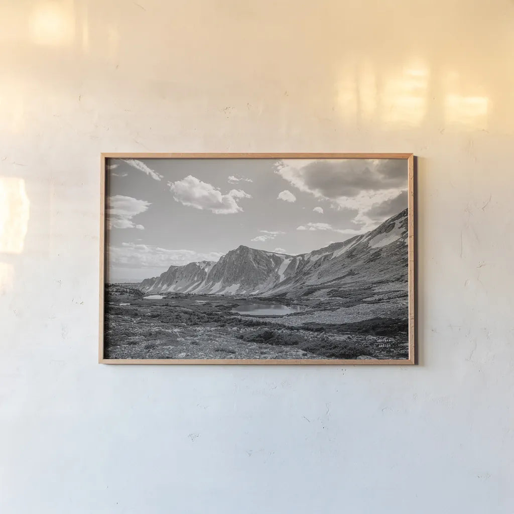 Wyoming Wonder by Nathan Larson. shown as a paper print in a natural frame. Available as a archival giclee rolled canvas, fine art paper, or poster print. SKU 81750i.
