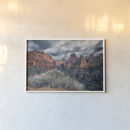 Zion National Park Storms by Nathan Larson. shown as a paper print in a white frame. Available as a archival giclee rolled canvas, fine art paper, or poster print. SKU 95629i.