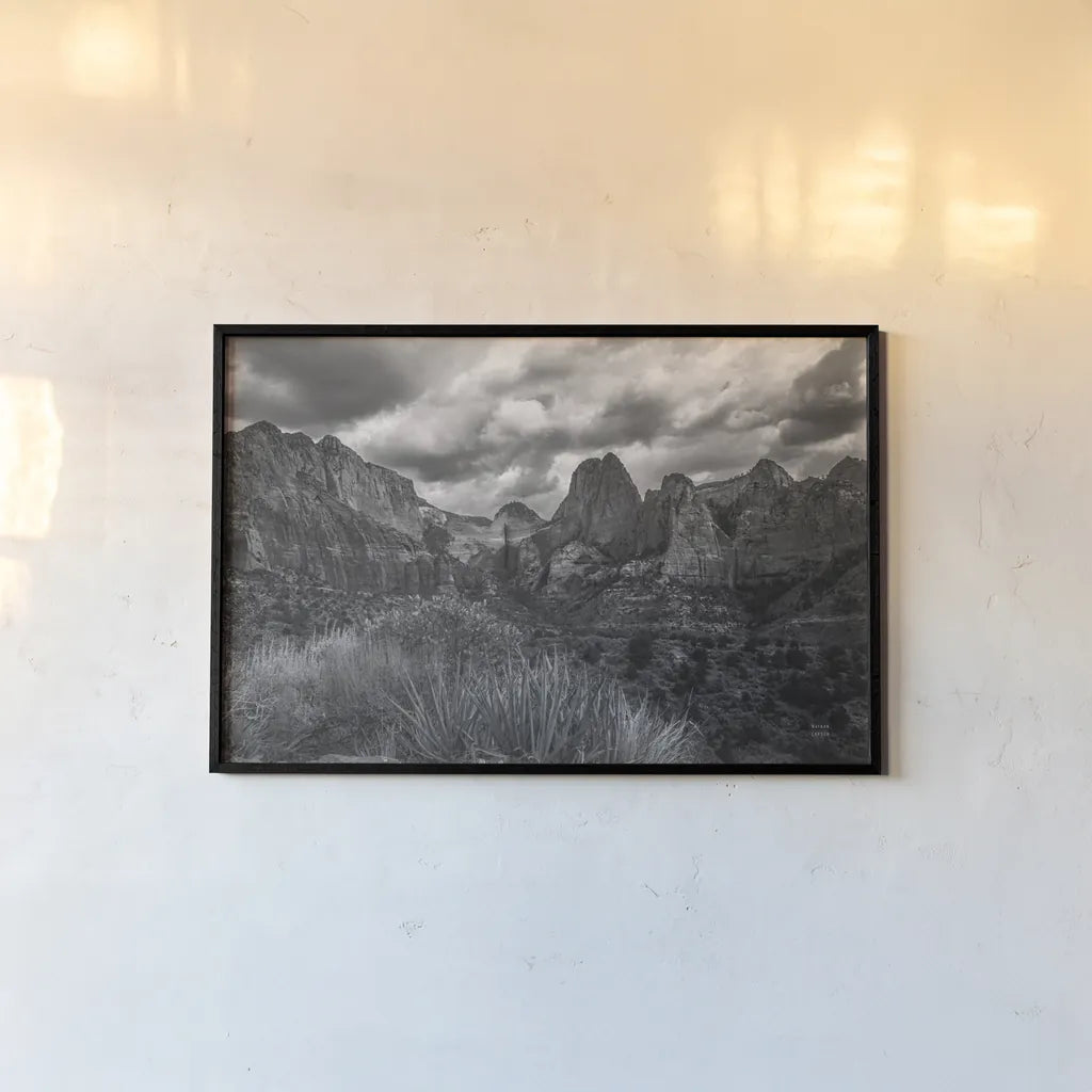 Zion National Park Storms BW by Nathan Larson. shown as a paper print in a black flame. Available as a archival giclee rolled canvas, fine art paper, or poster print. SKU 95630i.