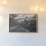 Zion National Park Storms BW by Nathan Larson. shown as a paper print in a natural frame. Available as a archival giclee rolled canvas, fine art paper, or poster print. SKU 95630i.