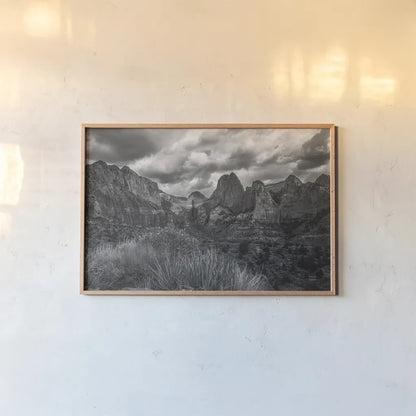 Zion National Park Storms BW by Nathan Larson. shown as a paper print in a natural frame. Available as a archival giclee rolled canvas, fine art paper, or poster print. SKU 95630i.