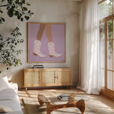 Cowgirly I by Omar Escalante. Shown in a natural wood frame in a cozy modern living room. Available as an archival giclee rolled canvas, fine art paper, or poster print. SKU 85859a.