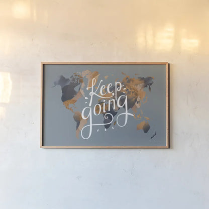 Keep Going World Map by Omar Escalante. shown as a paper print in a natural frame. Available as a archival giclee rolled canvas, fine art paper, or poster print. SKU 70407i.
