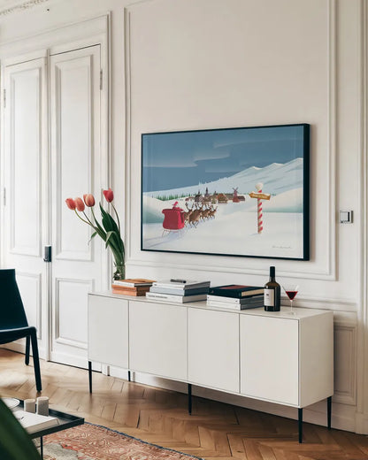 North Pole Christmas by Omar Escalante. shown as a framed stretched canvas in a living room above a console. Available as a archival giclee rolled canvas, fine art paper, or poster print. SKU 74907i.