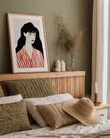 Woman in Striped Blouse I by Omar Escalante. shown as a paper print in a natural frame. Available as a archival giclee rolled canvas, fine art paper, or poster print. SKU 98857h.