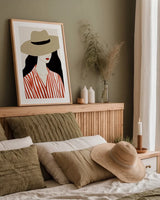 Woman in Striped Blouse I v2 by Omar Escalante. shown as a paper print in a natural frame. Available as a archival giclee rolled canvas, fine art paper, or poster print. SKU 100931h.