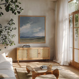 August Storm Light by Pamela Munger. Shown in a natural wood frame in a cozy modern living room. Available as an archival giclee rolled canvas, fine art paper, or poster print. SKU 88496a.